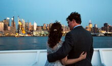 after the wedding ceremony: couple looking at the New York skyline